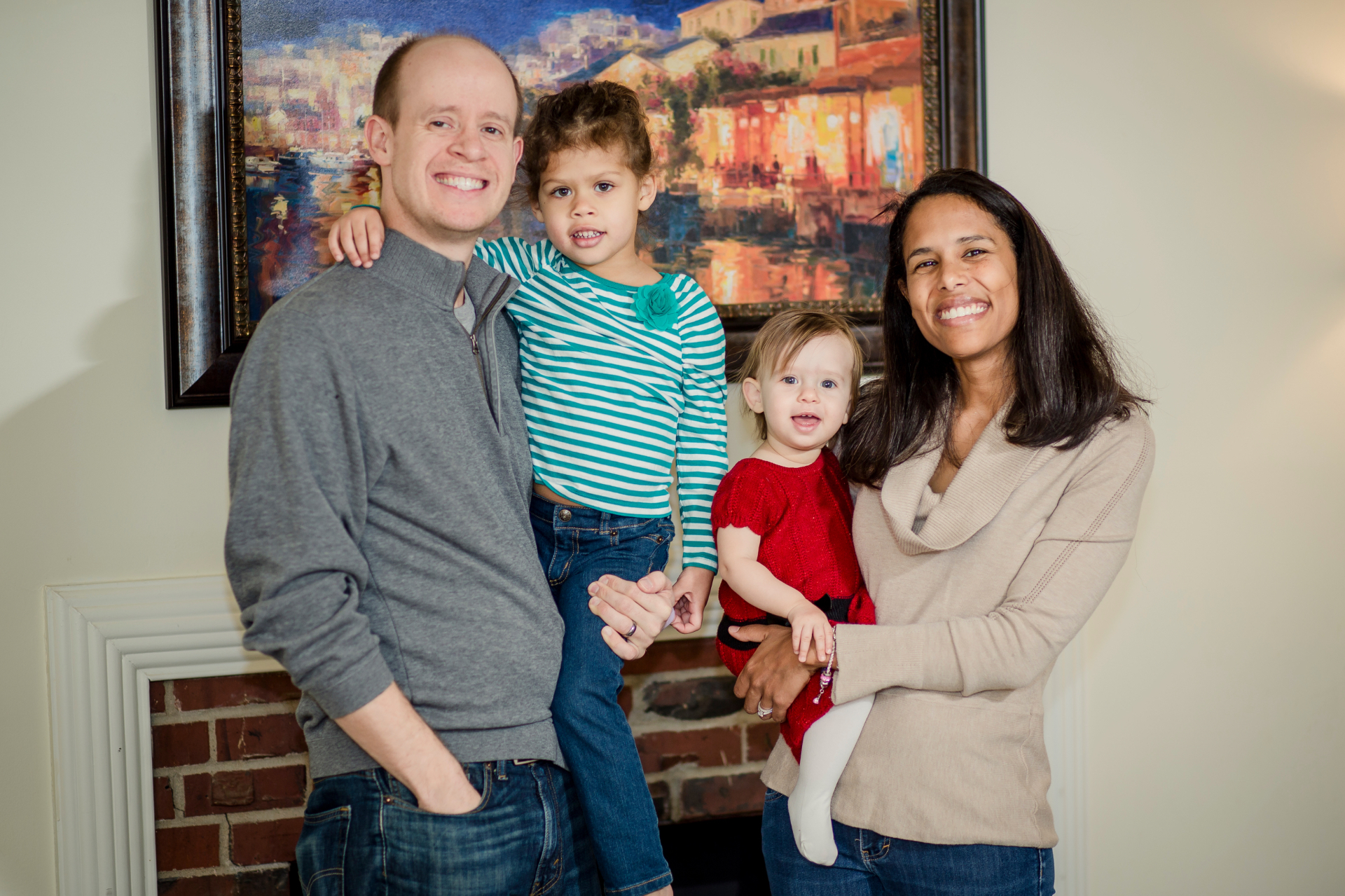Briana, Jeff, and their two daughters together at home